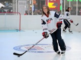 USA Hockey player Meghan Duggan participates in a demo during the USOC 100 Days Out 2014 Sochi Winter Olympics Celebration at Times Square on October 29, 2013