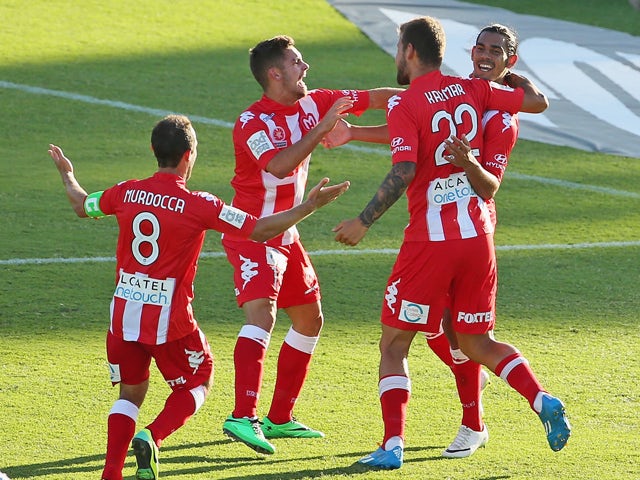 David Williams of the Heart celebrates with his teammates after scoring the winning goal during the round 18 A-League match between Melbourne Heart and Perth Glory at Lavington Sports Ground on February 9, 2014