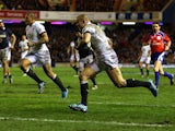 England's Mike Brown runs ahead to score a try against Scotland during their Six Nations match on February 8, 2014