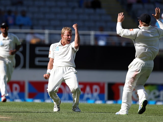 New Zealand's Neil Wagner celebrates the wicket of India's Zaheer Khan during day four of the international cricket Test match between New Zealand and India played at Eden Park in Auckland on February 9, 2014