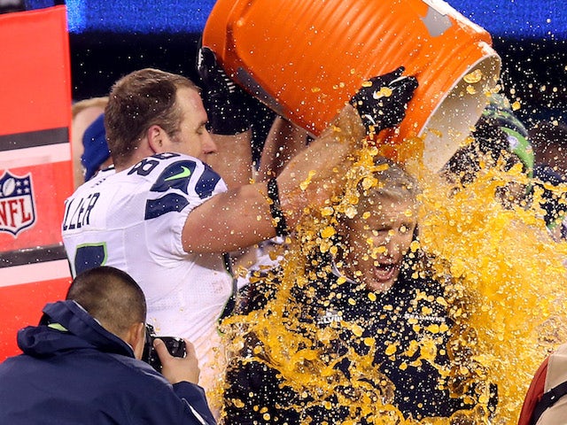 Tight end Zach Miller #86 of the Seattle Seahawks dumps Gatorade on head coach Pete Carroll in the fourth quarter of Super Bowl XLVIII on February 2, 2014