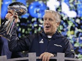 Head coach Pete Carroll of the Seattle Seahawks celebrates with the Vince Lombardi Trophy after their 43-8 victory over the Denver Broncos during Super Bowl XLVIII on February 2, 2014