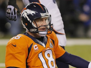 Manning claims 500 TD passes as Denver win