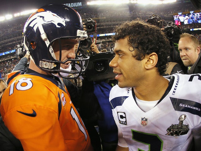 Quarterback Peyton Manning #18 of the Denver Broncos congratulates quarterback Russell Wilson #3 of the Seattle Seahawks on their 43-8 win on February 2, 2014
