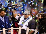 Russell Wilson #3 of the Seattle Seahawks celebrates with the Vince Lombardi trophy after defeating the Denver Broncos 43-8 in Super Bowl XLVIII  on February 2, 2014