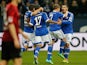 Schalke players celebrate the opening goal against Hannover during their Bundesliga match on February 9, 2014