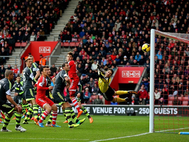 Asmir Begovic of Stoke watches Ricky Lambert's free kick fly past him to make it 1-0 during the Barclays Premier League match between Southampton and Stoke City at St Mary's Stadium on February 8, 2014