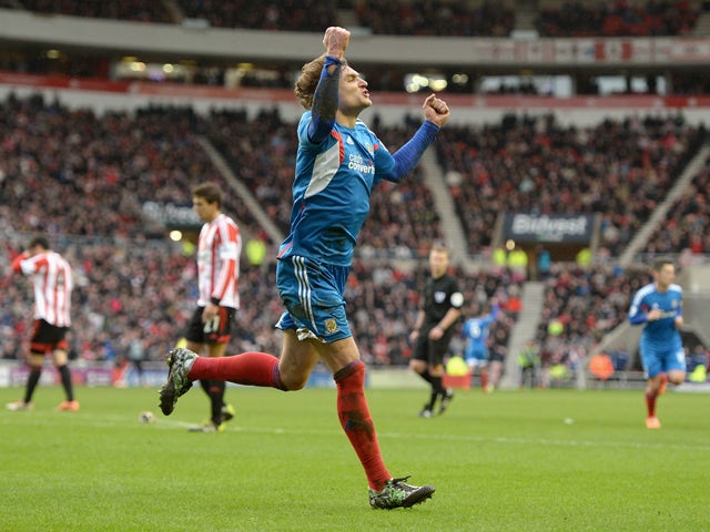 Nikica Jelavic of Hull City scores his team's second goal during the Premier League match between Sunderland and Hull City at Stadium of Light on February 8, 2014