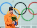 Netherlands' gold medalist Sven Kramer poses on the podium during the flower cermony after in the Men's Speed Skating 5000m at the Adler Arena during the 2014 Sochi Winter Olympics on February 8, 2014