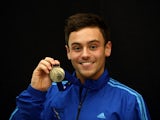 Tom Daley of England holds his gold medal after winning the Mens 10m Platform Final during Day 3 of the British Gas National Cup on February 2, 2014