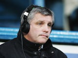 Pundit Tony Gale sits in the commentary box during the Barclays Premiership match between Portsmouth and West Ham United at Fratton Park on December 26, 2005