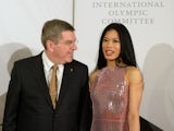 International Olympic Committee (IOC) President Thomas Bach chats with former musician Vanessa-Mae, who will compete for Thailand as Alpine skier Vanessa Vanakorn before the IOC Presidents Gala Dinner on February 6, 2014