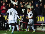 Swansea's Wayne Routledge celebrates after scoring the opening goal against Cardiff during their Premier League match on February 8, 2014