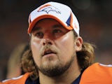 Guard Zane Beadles of the Denver Broncos watches from the sidelines against the Arizona Cardinals on August 29, 2013