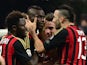 AC Milan's forward Mario Balotelli celebrates with teammate Adil Rami after scoring a goal during the Serie A football match between AC Milan and Bologna at San Siro Stadium in Milan on February 14, 2014