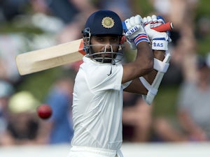 India survive late batting collapse
