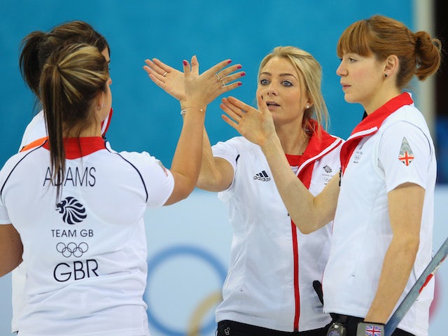 Anna Sloan, Vicki Adams, Claire Hamilton and Eve Muirhead of Great Britain congratulate each other after their win during the Curling Round Robin match against China on February 13, 2014