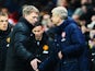 Manchester United manager David Moyes and Arsenal manager Arsene Wenger shake hands at the end of the Barclays Premier League match between Arsenal and Manchester United at the Emirates Stadium on February 12, 2014