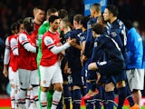 The two teams exchange handshakes before the Barclays Premier League match between Arsenal and Manchester United at the Emirates Stadium on February 12, 2014