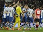 Espanyol´s players celebrate their victory at the end of the Spanish league football match Athletic Bilbao vs Espanyol de Barcelona at the San Mames stadium in Bilbao on February 16, 2014