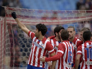 Atletico cruise to easy win