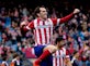 Half-Time Report: Godin puts Atletico ahead