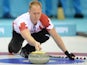 Canada's Brad Jacobs releases a stone during the 2014 Sochi winter olympics men's curling round robin session 1 match against Germany at the Ice Cube curling centre in Sochi on February 10, 2014
