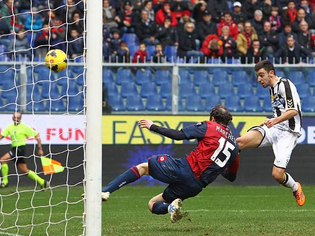Udinese's Bruno Fernandes scores his team's second goal against Genoa during their Serie A match on February 16, 2014