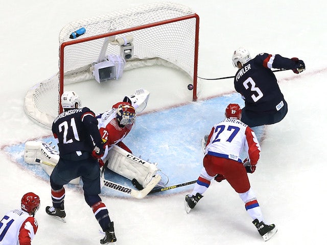 Cam Fowler #3 of the United States scores a goal against Sergei Bobrovski #72 of Russia during the Men's Ice Hockey Preliminary Round Group A game on February 15, 2014