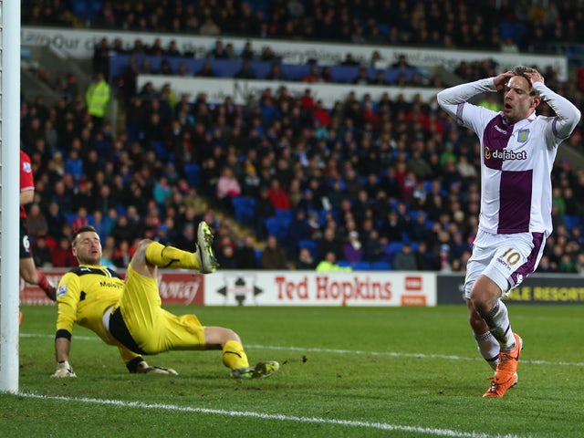 David Marshall of Cardiff City makesr a last minute save from Andreas Weimann during the Barclays Premier League match between Cardiff City and Aston Villa at the Cardiff City Stadium on February 11, 2014 
