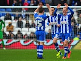 Wigan player Ben Watson celebrates his goal during the FA Cup Fifth Round match between Cardiff City and Wigan Athletic at Cardiff City Stadium on February 15, 2014