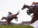 Barry Geraghty on Bob's Worth land safely over the last ahead of Long Run and Sir des Champs on their way to victory in the Chentenham Gold Cup Steeple Chase at Cheltenham Racecourse on March 15, 2013 