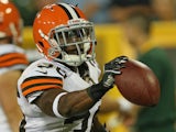 David Sims of the Cleveland Browns returns an interception for a touchdown against the Green Bay Packers during a preseason game at Lambeau Field on August 16, 2012