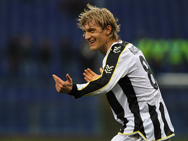 Udinese's Dusan Basta celebrates after scoring the opening goal against Genoa during their Serie A match on February 16, 2014