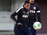 Copa Libertadores champion Corinthians of Brazil midfielder Edenilson kicks the ball in front of defender Wallace during a training session in the 2012 Club World Cup in Yokohama on December 14, 2012