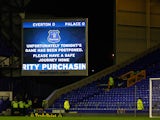 A public notice is displayed on the scoreboard after the match is postponed due to the weather before the Barclays Premier League match between Everton and Crystal Palace at Goodison Park on February 12, 2014