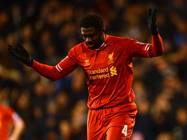 Kolo Toure of Liverpool reacts after he scored an own goal during the Barclays Premier League match between Fulham and Liverpool at Craven Cottage on February 12, 2014