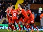 Philippe Coutinho of Liverpool celebrates scoring their second goal with team mates during the Barclays Premier League match between Fulham and Liverpool at Craven Cottage on February 12, 2014