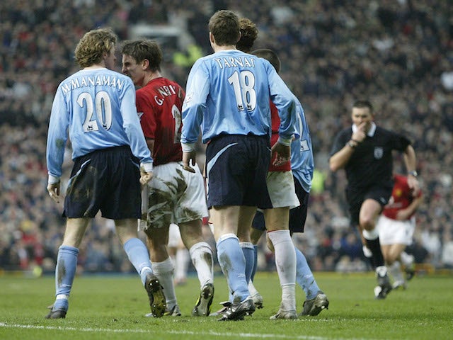 Gary Neville of Man Utd argues with Steve McManaman of Man City before he is sent off during the FA Cup Fifth Round match on February 14, 2014