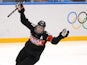 Hayley Wickenheiser #22 of Canada celebrates after scoring a goal against Florence Schelling #41 of Switzerland in the second period during the Women's Ice Hockey Preliminary Round Group A Game on day 1 of the Sochi 2014 Winter Olympics at Shayba Arena on