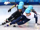 Yuri Confortola of Italy and Jack Whelbourne of Great Britain compete in the Short Track Speed Skating Men's 1500m qualifying on day 3 of the Sochi 2014 Winter Olympics at Iceberg Skating Palace on February 10, 2014