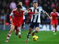 Adam Lallana of Southampton and James Morrison of West Bromwich Albion challenge for the ball during the Barclays Premier League match between Southampton and West Bromwich Albion at St Mary's Stadium on January 11, 2014