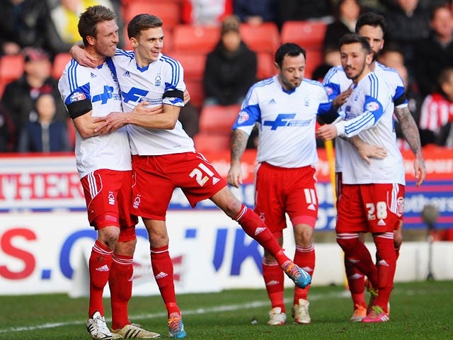 Forest's Jamie Paterson celebrates with teammates after scoring the opening goal against Sheffield United during their FA Cup fifth round match on February 9, 2014