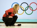 Canadian Jennifer Jones reacts as she throws the stone during the 2014 Sochi winter Olympics women's curling round robin session 4 match against Great Britain at the Ice Cube curling centre in Sochi on February 12, 2014