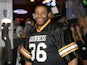 Former NFL player Jerome Bettis competes in the Guinness Perfect Pint Pour-Off at Buffalo Wild Wings on February 3, 2011 