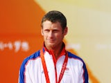 Joe Glanfield of Great Britain celebrates with his silver medal after finishing second placed overall in the Men's 470 class event held at the Qingdao Olympic Sailing Center during day 10 of the Beijing 2008 Olympic Games on August 18, 2008