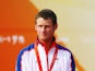 Joe Glanfield of Great Britain celebrates with his silver medal after finishing second placed overall in the Men's 470 class event held at the Qingdao Olympic Sailing Center during day 10 of the Beijing 2008 Olympic Games on August 18, 2008