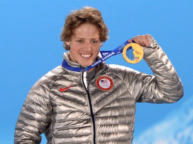 US gold medalist Joss Christensen celebrating with his medal during the Men's Freestyle Skiing Slopestyle Medal Ceremony on February 13, 2014