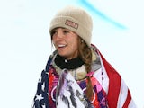 Gold medalist Kaitlyn Farrington of the United States celebrates during the flower ceremony for the Snowboard Women's Halfpipe Finals on day five of the Sochi 2014 Winter Olympics at Rosa Khutor Extreme Park on February 12, 2014
