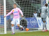 Evian's Kevin Berigaud celebrates after scoring his team's opening goal against Lille during their Ligue 1 match on February 16, 2014